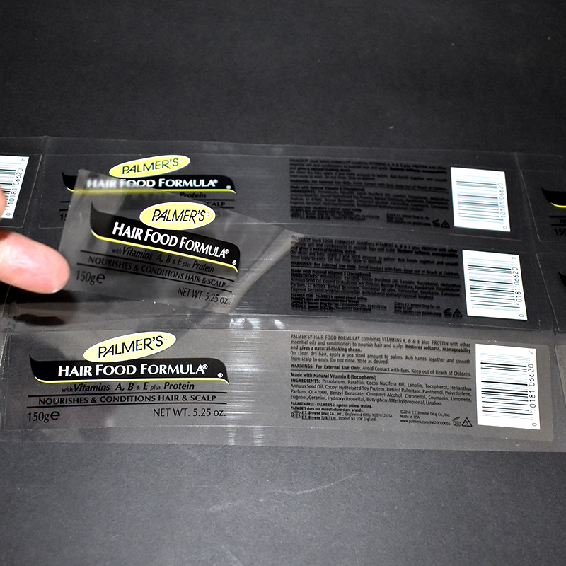 Printed clear plastic packaging with bold white text for pet product and retail packaging applications