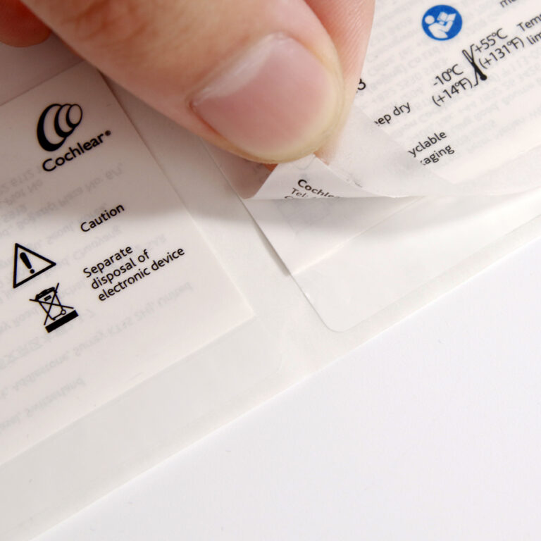 Peel and reveal label with resealable adhesive