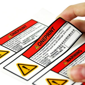 Custom variable data warning labels with peel-off adhesiv