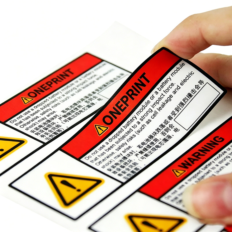 Custom variable data warning labels with peel-off adhesiv
