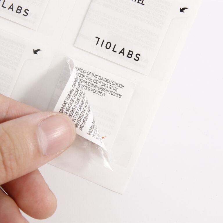 Resealable multi-layer label with secure hinge design